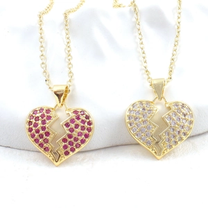 Golden broken heart pendant necklace set with micro-paved red and white zircon crystals