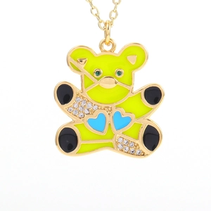 Detailed shot of green enamel bear pendant with blue hearts and zircon inlay necklace