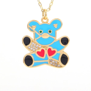 Detailed macro of a blue enamel teddy bear pendant with micro-pave zircon and red hearts
