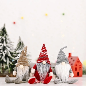 Three Christmas forest gnomes with striped hats and long beards on a soft snowy background