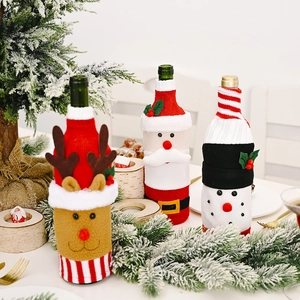 Three-piece Christmas wine bottle covers featuring Santa, reindeer and snowman designs
