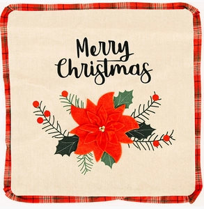 Detail of poinsettia pillow cover with Merry Christmas script and red plaid piping