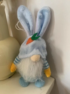 Detail of Easter gnome doll with rabbit ears, orange carrot top and silver tinsel beard