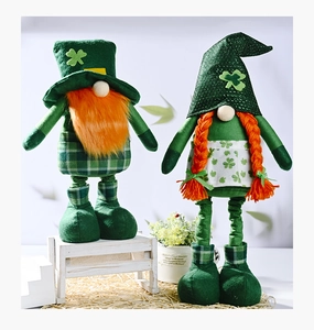 Detail of St. Patrick's Day gnomes with orange beards, braids, and clover embroidery
