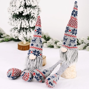 Set of two grey knit Christmas gnomes with reindeer patterns and long dangling legs