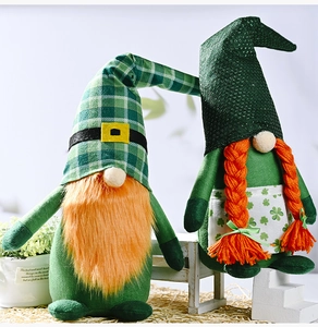 Detail showing two St. Patrick's Day gnomes with green shamrock patterns and orange beards