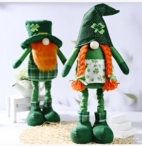 Close-up of plush St. Patrick's Day gnomes with clover patterns and green festive hats