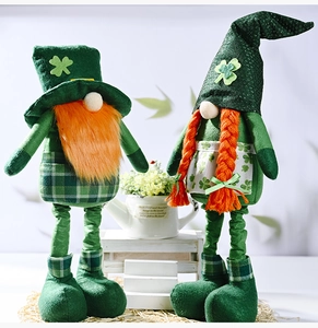 Detail of St. Patrick's Day gnomes with clover hats and orange beards on a stand