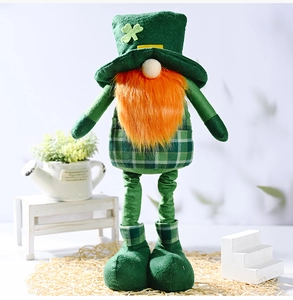 Detail of St. Patrick's Day gnome with green clover hat and orange beard on straw mat