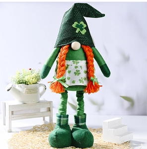 Detail of St. Patrick's Day gnome with green clover hat and orange braided hair