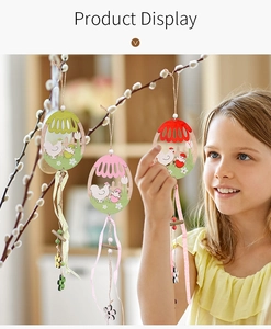 Detailed view of colorful wooden Easter egg ornaments with hen and chick cutout patterns