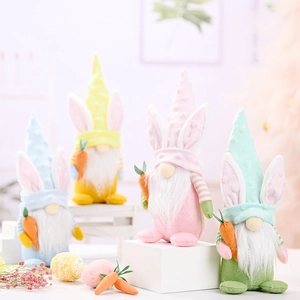 Easter gnome plush set with rabbit ears and carrots on white wooden steps