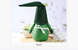 Back view of St. Patrick's Day gnome featuring a tall green hat and clover ribbon detail