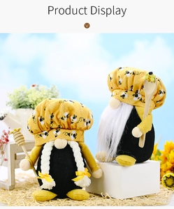 Detailed close-up of bee-themed gnomes with honeycomb hats and wooden honey stirrers