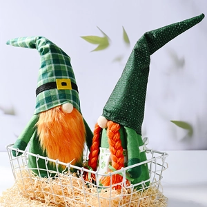 Pair of St. Patrick's Day gnomes with green hats and orange beards on white background