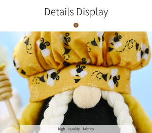 Detail of high-quality fabric and cartoon bee patterns on yellow gnome plush