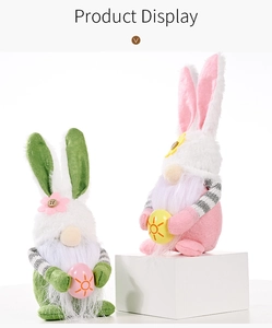 Detail of Easter gnomes with rabbit ears holding decorative eggs on white pedestals