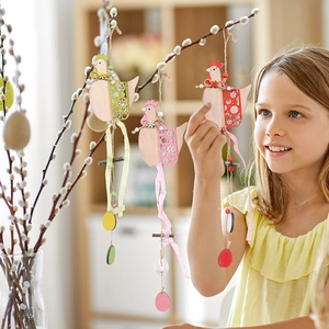 Three-piece set of hollow carved wooden Easter hen ornaments with checkered ribbons
