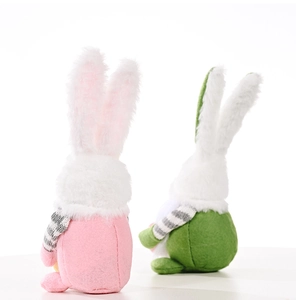 Rear view detail of Easter gnome dolls featuring pink ears and striped sleeve texture