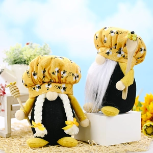 Set of two bumblebee gnomes with chef hats and honey dippers for kitchen decoration