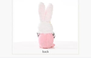 Rear view of Easter gnome plush with pink ears and grey striped fabric texture