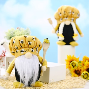 Handmade bee festival gnomes with chef hats and wooden spoons on sunflower background