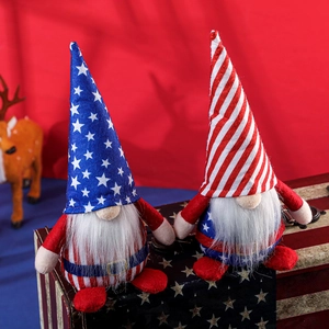 Pair of patriotic American Independence Day gnomes with stars and stripes theme on wood box