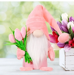 Detailed plush gnome holding tulip flowers against a blurred spring nature background
