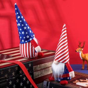 Patriotic USA Independence Day gnomes with stars and stripes set on a vintage suitcase