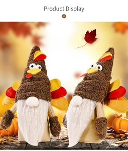 Close-up of plush Thanksgiving turkey gnomes with felt feathers and white beard decor