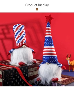 Detail of plush 4th of July gnomes with star and stripe patterns on a red background
