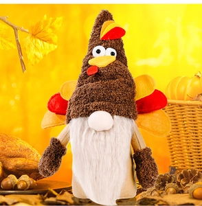 Detailed view of plush Thanksgiving turkey gnome with pumpkin and pine cones scenery