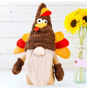 Detailed view of plush Thanksgiving turkey gnome with colorful felt tail feathers