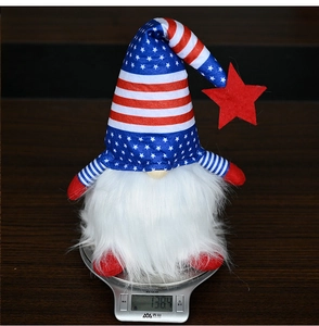 Detailed shot of an Independence Day gnome showing its weight on a silver scale
