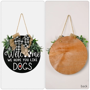 Rustic round wooden Dog Welcome door sign with black finish and burlap bow decoration