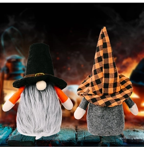 Detail of Halloween gnomes with tall hats and beards on a festive wooden table