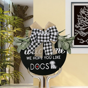 Rustic wood welcome sign with buffalo plaid bow and greenery for dog lovers home decor