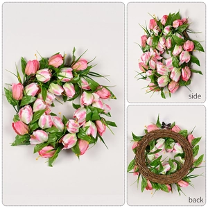 Pink and white tulip artificial wreath with green leaves on brown rattan for home wall decor