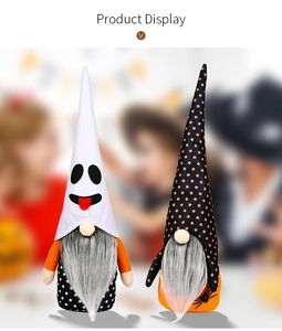 Close-up of Halloween gnome plush dolls featuring ghost hat and spider web details
