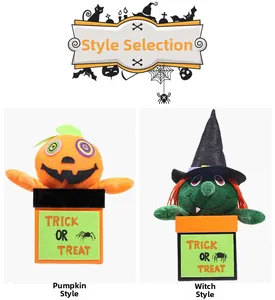 Detail of Halloween plush pumpkin and witch dolls in trick or treat decorative gift boxes