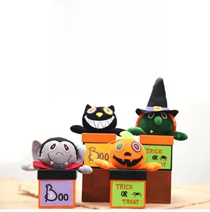 Set of four plush Halloween characters including vampire, black cat, witch, and pumpkin dolls
