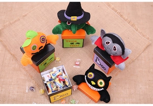 Detailed top view of Halloween plush candy gift boxes featuring wizard and pumpkin monsters