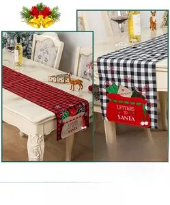 Close-up of Christmas table runner with red and black plaid and Santa letter pocket