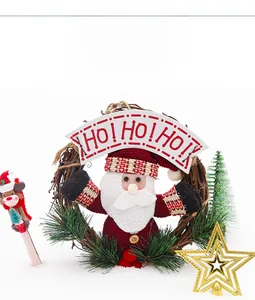 Close-up of a rustic rattan Christmas wreath with Santa Claus and HO HO HO banner detail