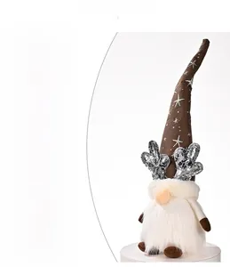 Detail view of glowing Christmas gnome with sequined antlers and battery compartment