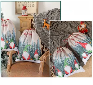 Detail of Christmas gnome drawstring gift bag in beige fabric with festive pattern