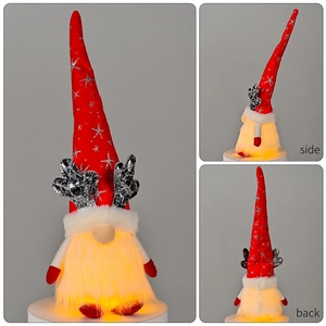Macro detail of Christmas gnome with glowing LED lights, silver antlers and red star hat