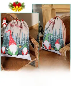 Close-up of linen Christmas drawstring gift bag with festive gnome print and red lettering
