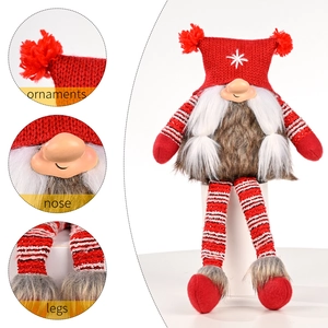 Christmas gnome doll with red knitted hat, white beard, and striped hanging legs ornament