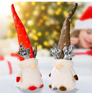 Detail of Christmas gnomes with light-up reindeer antlers and silver star patterned hats